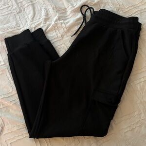 Women’s medium size black joggers with side pockets. Perfect condition